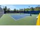 A well-maintained pickleball court with blue and green surfaces provides a space for friendly competition and community recreation at 129 Chateau Whistler Ct, Las Vegas, NV 89148