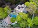 Aerial view of a private backyard, showcasing a pool, lush landscaping, and a putting green at 1309 Reisling Ct, Las Vegas, NV 89144