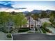 Beautiful aerial view showcasing the home's well-manicured grounds and its position against a backdrop of picturesque mountains at 1309 Reisling Ct, Las Vegas, NV 89144