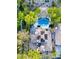 Aerial view of estate featuring solar panels, a sparkling pool, meticulously landscaped grounds, and outdoor seating at 1309 Reisling Ct, Las Vegas, NV 89144