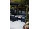 Backyard with fire pit, comfortable seating, mature trees, and tasteful landscaping at 1309 Reisling Ct, Las Vegas, NV 89144