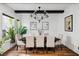 Dining area with hardwood floors, modern chandelier, and view of the front yard at 1309 Reisling Ct, Las Vegas, NV 89144