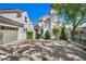 Exterior shot of this home with a circular driveway and gated entrance at 1309 Reisling Ct, Las Vegas, NV 89144