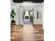 Entryway with tiled floors, white walls, a decorative wall hanging and an outdoor fireplace view at 1309 Reisling Ct, Las Vegas, NV 89144