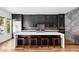 Gourmet kitchen boasts dark cabinetry, an island with seating, and stainless appliances at 1309 Reisling Ct, Las Vegas, NV 89144