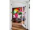 Home office with colorful wall mural, desk, chair, and natural light at 1309 Reisling Ct, Las Vegas, NV 89144