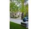 Stylish pool house featuring bright white walls, tile flooring and beautiful landscaping at 1309 Reisling Ct, Las Vegas, NV 89144