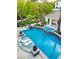 Gorgeous pool with an attached spa, in-pool lounge chairs, and lush landscaping create a private backyard retreat at 1309 Reisling Ct, Las Vegas, NV 89144