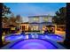 Backyard oasis with a luxurious pool, spa, and outdoor seating, perfect for relaxation and entertainment at 1309 Reisling Ct, Las Vegas, NV 89144