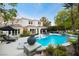 Stunning backyard pool with lounge chairs, manicured landscaping, and outdoor seating area perfect for entertaining at 1309 Reisling Ct, Las Vegas, NV 89144
