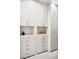 Custom walk-in closet featuring built-in shelving and drawers for organized storage at 1309 Reisling Ct, Las Vegas, NV 89144