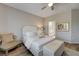 Comfortable bedroom featuring a neutral color palette, wood look floors, and a sitting area at 1372 Couperin Dr, Henderson, NV 89052