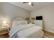 Inviting bedroom features soft natural light, a ceiling fan, and dresser at 1372 Couperin Dr, Henderson, NV 89052