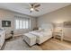 Cozy bedroom featuring a neutral color palette, wood look floors and great natural light at 1372 Couperin Dr, Henderson, NV 89052