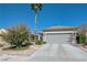 Charming home exterior featuring a spacious driveway, two car garage, and manicured landscaping at 1372 Couperin Dr, Henderson, NV 89052