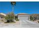 Charming single-story home features a low-maintenance desert landscaped yard, driveway, and a two car garage at 1372 Couperin Dr, Henderson, NV 89052