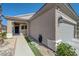 Inviting home exterior featuring a covered entry, attached garage, and desert landscaping at 1372 Couperin Dr, Henderson, NV 89052