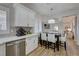 Eat-in kitchen with a sleek, modern eat-in kitchen and wood look flooring at 1372 Couperin Dr, Henderson, NV 89052