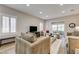 Cozy living room featuring neutral tones, hardwood floors, recessed lighting and a sliding glass door at 1372 Couperin Dr, Henderson, NV 89052