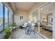 Cozy sunroom with tile flooring, an open concept, lots of natural light and access to the main house at 1372 Couperin Dr, Henderson, NV 89052