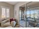 Cozy sunroom with tiled floors, large sliding glass door and comfortable seating with views of the yard at 1372 Couperin Dr, Henderson, NV 89052