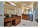 Elegant bathroom featuring double vanity sinks, a large mirror, and modern finishes at 145 E Harmon Ave # 3101, Las Vegas, NV 89109