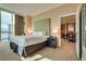 Comfortable bedroom featuring a king-size bed and a glimpse into the dining area at 145 E Harmon Ave # 3101, Las Vegas, NV 89109