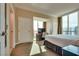 Sunlit bedroom with city views, workspace, and comfortable bed at 145 E Harmon Ave # 3101, Las Vegas, NV 89109