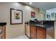 Sleek kitchenette boasts dark countertops, stainless steel dishwasher, and decorative wall art for a modern and inviting space at 145 E Harmon Ave # 3101, Las Vegas, NV 89109