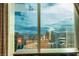 Breathtaking high-rise view from a large window showcases the city skyline and distant mountains at 145 E Harmon Ave # 3101, Las Vegas, NV 89109
