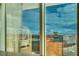 Expansive high-rise view through a large window frames the city's iconic buildings and dynamic sky at 145 E Harmon Ave # 3101, Las Vegas, NV 89109