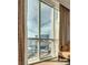 Amazing high-rise view through expansive windows, enhanced by elegant curtains and comfortable seating at 145 E Harmon Ave # 3101, Las Vegas, NV 89109