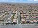 Aerial view of many single Gathering homes in a desert community with mountains in the background at 1776 Gentle Brook St, North Las Vegas, NV 89084