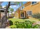 Inviting backyard with artificial grass, covered patio and a relaxing spa, perfect for outdoor living at 1776 Gentle Brook St, North Las Vegas, NV 89084