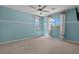 Spacious bedroom with carpet, ceiling fan, and two windows providing ample natural light at 1776 Gentle Brook St, North Las Vegas, NV 89084