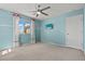 Comfortable bedroom with a ceiling fan, and a mounted television on the wall at 1776 Gentle Brook St, North Las Vegas, NV 89084