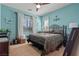 Cozy bedroom with a decorative iron bed frame and a ceiling fan at 1776 Gentle Brook St, North Las Vegas, NV 89084