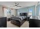 Modern bedroom featuring a ceiling fan and large windows at 1776 Gentle Brook St, North Las Vegas, NV 89084
