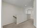 Hallway with carpeted floor, staircase, and neutral walls providing a clean and open feel at 1776 Gentle Brook St, North Las Vegas, NV 89084
