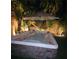 Enjoy a relaxing soak in this backyard hot tub, enhanced by ambient lighting, and swaying palm trees at 1776 Gentle Brook St, North Las Vegas, NV 89084