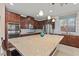Gourmet kitchen with stainless steel appliances, large island, granite countertops, and ample cabinet space at 1776 Gentle Brook St, North Las Vegas, NV 89084