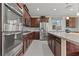 Modern kitchen with stainless steel appliances, granite countertops, and a functional layout for cooking and entertaining at 1776 Gentle Brook St, North Las Vegas, NV 89084