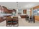 Open kitchen with stainless appliances, granite countertops, and adjacent dining area perfect for entertaining at 1776 Gentle Brook St, North Las Vegas, NV 89084