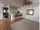 Cozy kitchen with bar seating area and ceiling fan with light at 1830 N Buffalo Dr # 2098, Las Vegas, NV 89128