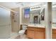 Well-lit bathroom featuring a glass-door shower, modern fixtures, and a neutral color scheme at 1960 Oliver Springs St, Henderson, NV 89052
