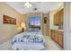 Cozy bedroom featuring natural light from a window, a ceiling fan, and ample cabinet space at 1960 Oliver Springs St, Henderson, NV 89052
