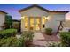 Charming courtyard with privacy landscaping and a swing offering relaxation in a serene setting at 1960 Oliver Springs St, Henderson, NV 89052