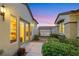 Beautiful courtyard with lush landscaping, a cozy swing, and seamless indoor-outdoor living at 1960 Oliver Springs St, Henderson, NV 89052