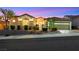 Inviting single-story home showcasing a neatly maintained lawn, attractive landscaping, and a tranquil neighborhood setting at 1960 Oliver Springs St, Henderson, NV 89052