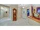 Bright foyer featuring tile flooring, chandelier, and decorative touches like a grandfather clock at 1960 Oliver Springs St, Henderson, NV 89052